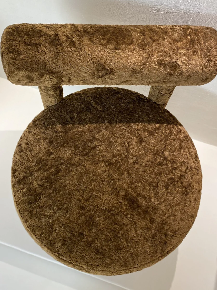 Tino T3 chair in a warm, neutral Riyadh interior